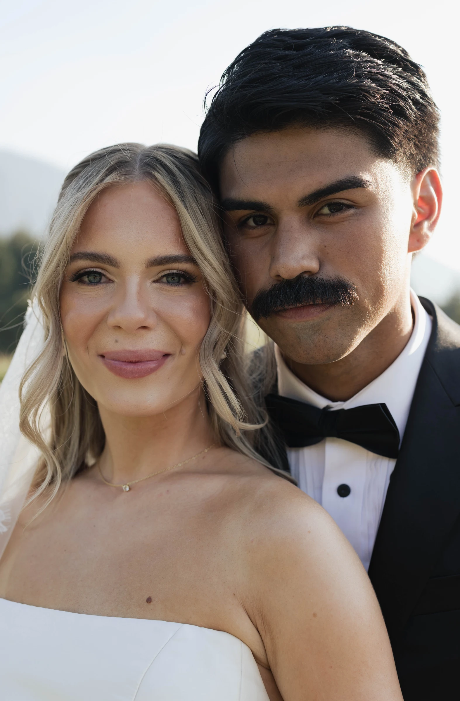 Oregon wedding, bride and groom standing close together.