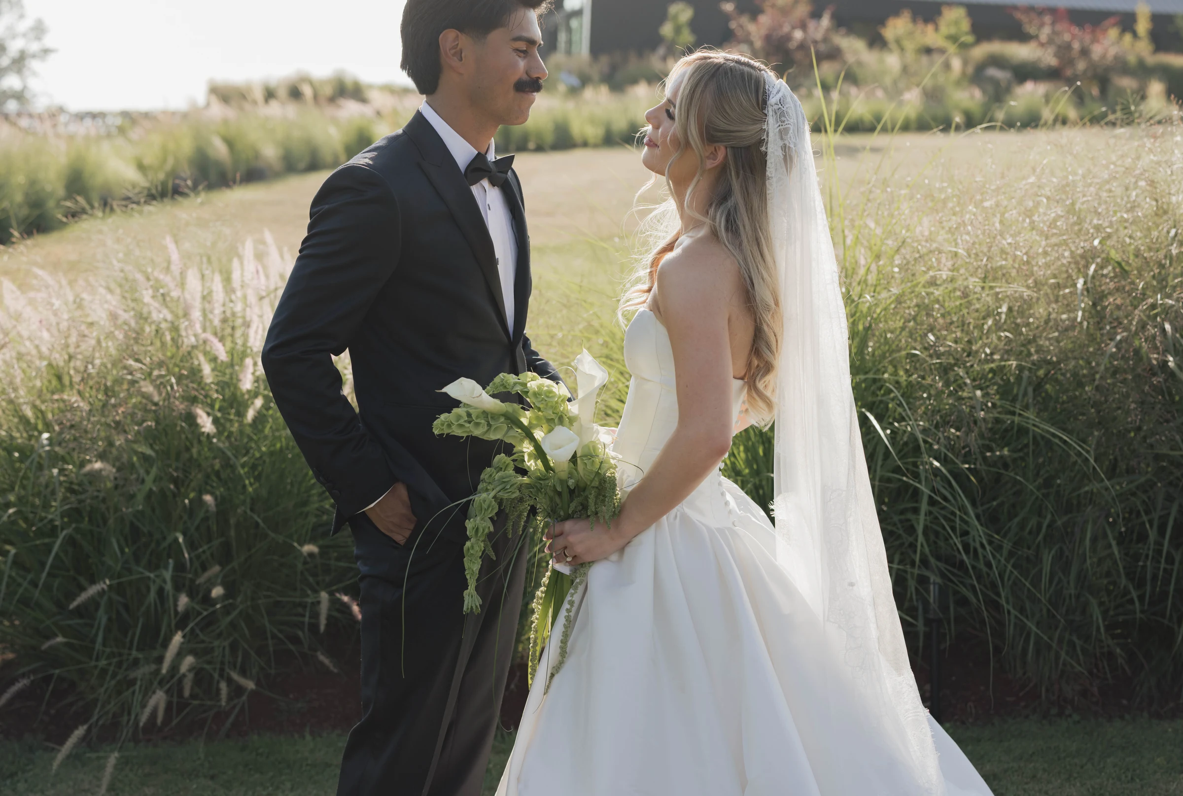 Beautiful couple standing facing each other at the Wind Mountain Ranch in Oregon